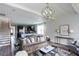 Open concept living room with high ceilings and views to kitchen and stairs at 778 Opal Wing St, Moncks Corner, SC 29461