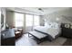 Spacious bedroom with king-size bed, wood furniture, and large windows at 778 Opal Wing St, Moncks Corner, SC 29461