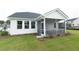 White house with a screened porch and landscaped yard at 778 Opal Wing St, Moncks Corner, SC 29461