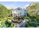 Serene backyard oasis with circular fountain and lush greenery at 79 Alexander St, Charleston, SC 29403