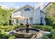 Charming backyard with fountain and manicured landscaping at 79 Alexander St, Charleston, SC 29403
