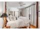 Bright bedroom featuring a four-poster bed and hardwood floors at 79 Alexander St, Charleston, SC 29403