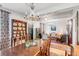 Open concept dining room and living room with hardwood floors and rugs at 79 Alexander St, Charleston, SC 29403