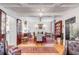 Bright dining room with hardwood floors, chandelier, and antique furnishings at 79 Alexander St, Charleston, SC 29403
