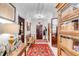 Elegant entryway with hardwood floors, antique furniture, and a beautiful rug at 79 Alexander St, Charleston, SC 29403