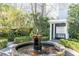 Brick fountain is the centerpiece of this charming courtyard at 79 Alexander St, Charleston, SC 29403