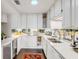 Modern kitchen with white cabinets, stainless steel appliances, and granite counters at 79 Alexander St, Charleston, SC 29403