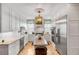 Modern kitchen with white cabinets, stainless steel appliances, and granite counters at 79 Alexander St, Charleston, SC 29403