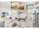 Modern kitchen with white cabinets, stainless steel appliances, and granite counters at 79 Alexander St, Charleston, SC 29403