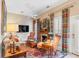 Relaxing living room with comfortable seating, a fireplace, and large windows at 79 Alexander St, Charleston, SC 29403