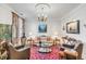 Cozy living room featuring a comfortable sofa, area rug and beautiful artwork at 79 Alexander St, Charleston, SC 29403