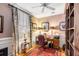 Home office with built-in shelving, hardwood floors, and a large window at 79 Alexander St, Charleston, SC 29403