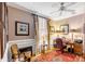 Home office with built-in shelving, hardwood floors, and a large window at 79 Alexander St, Charleston, SC 29403