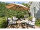 Relaxing patio features umbrella, seating, and brick flooring at 79 Alexander St, Charleston, SC 29403