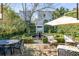 Inviting patio with fountain, seating, and lush landscaping at 79 Alexander St, Charleston, SC 29403