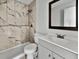 Updated bathroom with gray vanity and marble-look shower at 110 Manchester Rd, Summerville, SC 29486