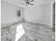 Spacious bedroom with large window and marble-look flooring at 110 Manchester Rd, Summerville, SC 29486