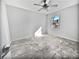 Sunlit bedroom with ceiling fan and marble-look flooring at 110 Manchester Rd, Summerville, SC 29486
