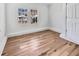 Bright bedroom featuring wood-look laminate flooring and new windows at 110 Manchester Rd, Summerville, SC 29486
