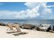 Two beach chairs on a sandy beach with ocean view at 1116 Summerwind Ln, Seabrook Island, SC 29455