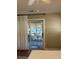 Bedroom with sliding glass door leading to a screened porch at 1116 Summerwind Ln, Seabrook Island, SC 29455