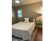 Cozy bedroom with a queen-size bed and nightstand at 1116 Summerwind Ln, Seabrook Island, SC 29455