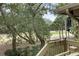 Deck overlooking the golf course with lush trees at 1116 Summerwind Ln, Seabrook Island, SC 29455