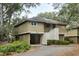 Light beige cottage with private driveway and lush landscaping at 1116 Summerwind Ln, Seabrook Island, SC 29455