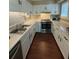 Well-equipped kitchen with white cabinets and stainless steel appliances at 1116 Summerwind Ln, Seabrook Island, SC 29455