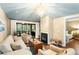 Living room with fireplace, hardwood floors, and access to screened porch at 1116 Summerwind Ln, Seabrook Island, SC 29455
