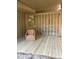 Screened-in porch with wicker chair and storage at 1116 Summerwind Ln, Seabrook Island, SC 29455