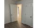 Well-lit bedroom with hardwood floors and an ensuite bathroom at 114 Groves St, Walterboro, SC 29488