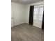 Spacious bedroom with hardwood floors and dark curtains at 114 Groves St, Walterboro, SC 29488