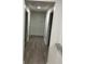 Bright hallway with hardwood floors and access to bedrooms at 114 Groves St, Walterboro, SC 29488