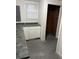 Kitchen with dark countertop and white cabinets at 114 Groves St, Walterboro, SC 29488