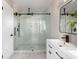 Modern bathroom with a large walk-in shower and hexagonal tile floor at 1216 Taliaferro Ave, Charleston, SC 29412