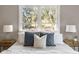 Main bedroom with a window view and stylish bedding at 1216 Taliaferro Ave, Charleston, SC 29412