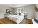 Cozy bedroom with a queen-size bed and hardwood floors at 1216 Taliaferro Ave, Charleston, SC 29412