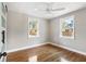 Spacious bedroom with hardwood floors and two bright windows at 1216 Taliaferro Ave, Charleston, SC 29412