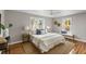 Bedroom with a queen bed, hardwood floors, and two windows at 1216 Taliaferro Ave, Charleston, SC 29412