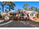 Brick home with new windows, landscaping, and a welcoming front porch at 1216 Taliaferro Ave, Charleston, SC 29412