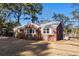 Charming brick home with a spacious yard and mature trees at 1216 Taliaferro Ave, Charleston, SC 29412