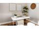 Modern home office with a white desk, comfortable chair, and natural light at 1216 Taliaferro Ave, Charleston, SC 29412
