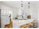 Modern kitchen with white cabinets, quartz countertops, and stainless steel appliances at 1216 Taliaferro Ave, Charleston, SC 29412
