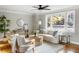 Living room with hardwood floors, large windows, and comfortable furnishings at 1216 Taliaferro Ave, Charleston, SC 29412
