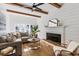 Living room with fireplace, sectional sofa, and exposed wooden beams at 1216 Taliaferro Ave, Charleston, SC 29412