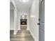 Bright entryway with wood-look flooring leading to a living room with a fireplace at 127 Roberts Rd, Summerville, SC 29483