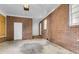 Unfinished brick garage with concrete floor and ample space at 127 Roberts Rd, Summerville, SC 29483