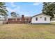 Brick and white sided home with a large backyard at 127 Roberts Rd, Summerville, SC 29483