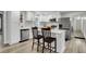 Modern kitchen with white cabinets, granite countertops, and stainless steel appliances at 127 Roberts Rd, Summerville, SC 29483